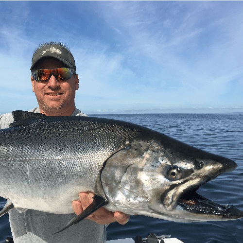 Our client holding up a king salmon